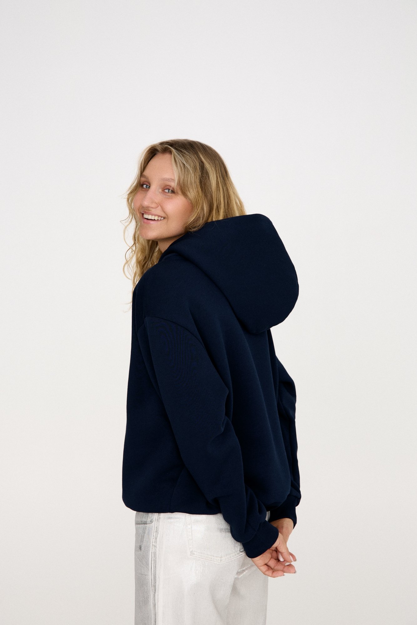 Navy MINIMAL hoodie is inspired by minimalism, offering a relaxed fit for ultimate comfort. It’s embroidered with the signature GREI studio charm – SMILE, adding a playful touch. Designed with a lowered shoulder seam, the hoodie features ribbed crew neck, cuffs, and bottom, creating a clean, timeless look. Relaxed fit for ultimate comfort Ribbed crew neck, cuffs, and bottom Embroidered with the GREI studio SMILE charm Long-lasting fabric: 65% cotton, 35% polyester